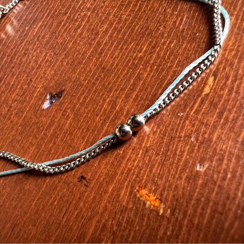 Fine chain bracelet with cord and bead accent